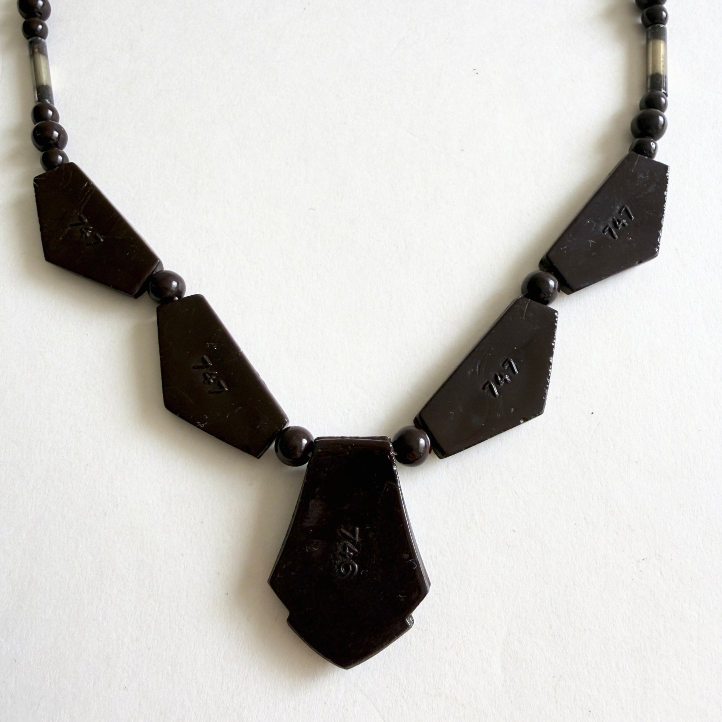 Vintage Czech Art Deco necklace with dark amethyst molded glass panels, rhinestone accents and silvered glass tube beads, circa 1930s.