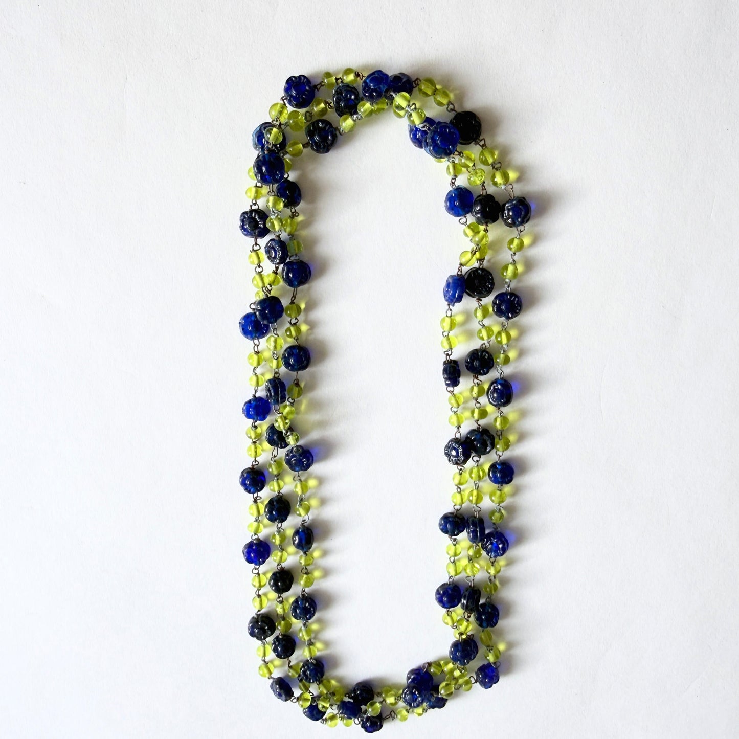 Vintage Czech glass necklace with blue floral beads and uranium green glass glowing under UV light, 53 inch strand
