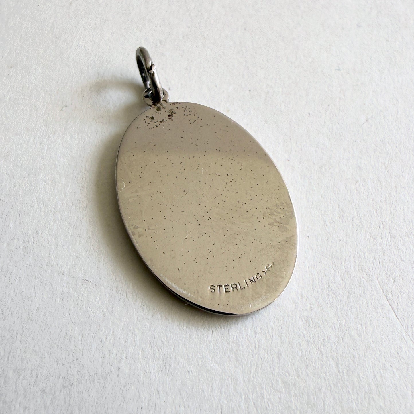 Vintage sterling silver pendant with faith hope charity symbols including cross anchor and heart