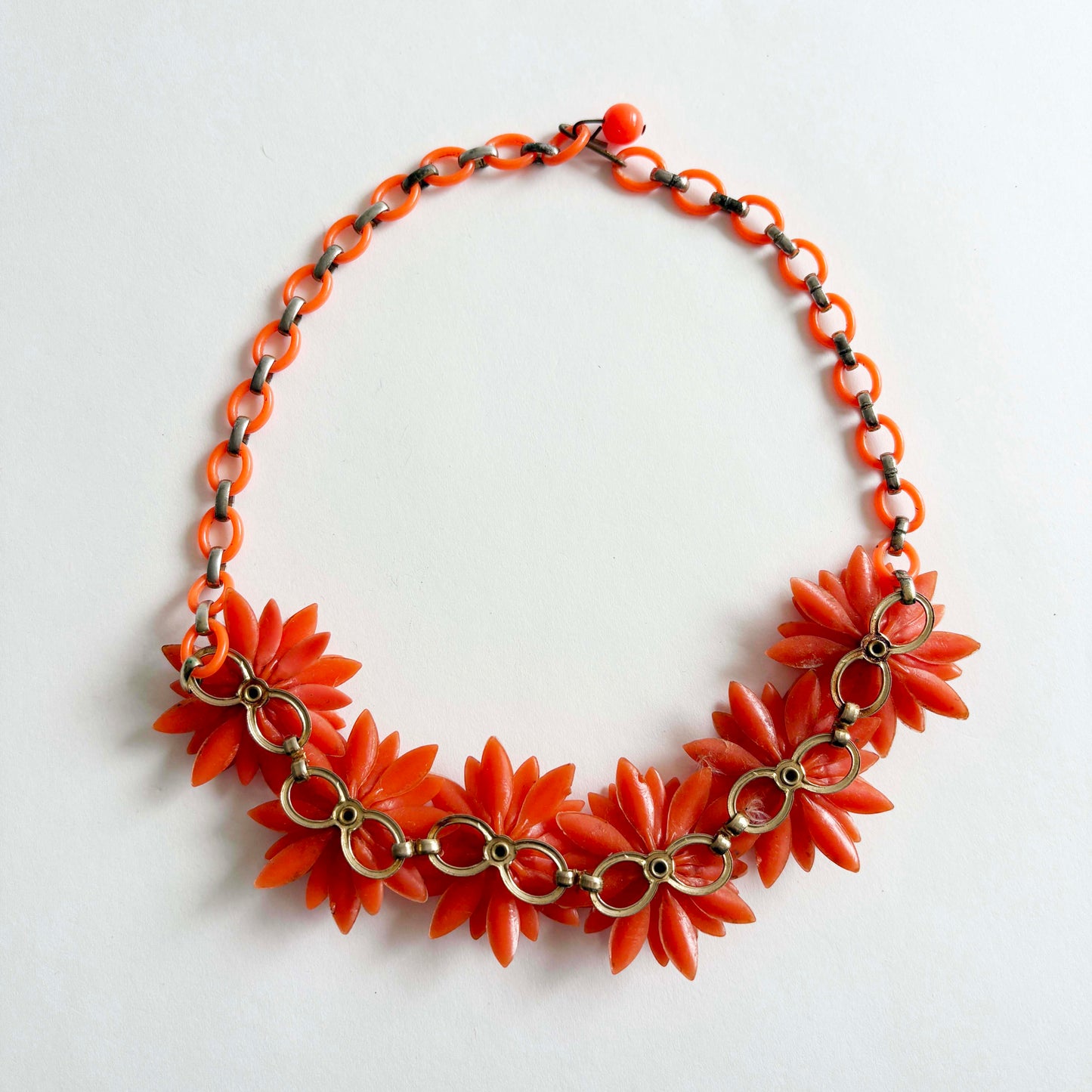 Vintage Coro orange soft plastic flower necklace with AB rhinestones, 1960s, the back side shown