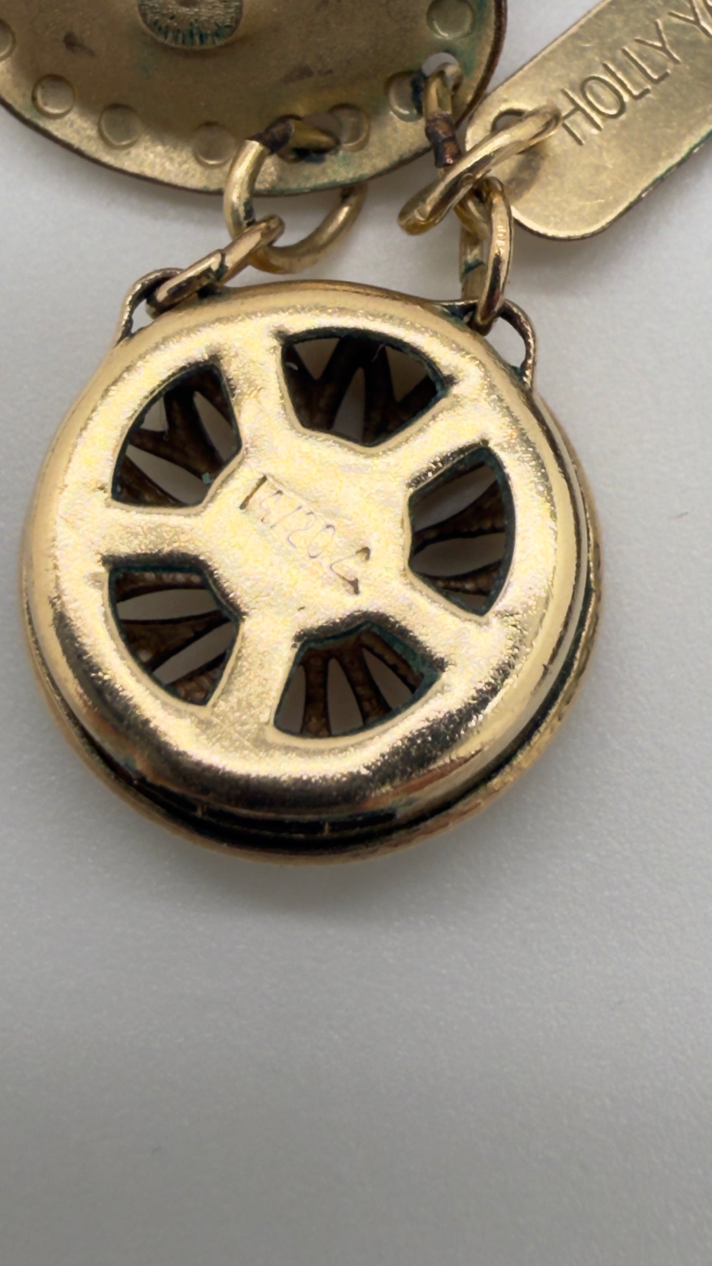 Gold clasp closeup on a gray background