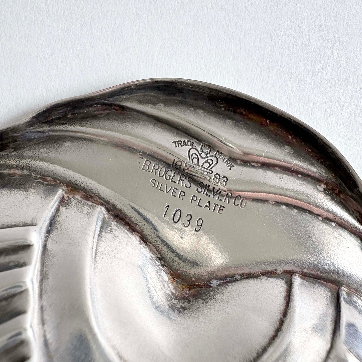 The base of the tray showing the F.B. Rogers Silver Co. maker's mark and pattern number 1039.