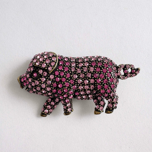 Retired Heidi Daus pink pig brooch covered in Swarovski crystals with gold tone metal details