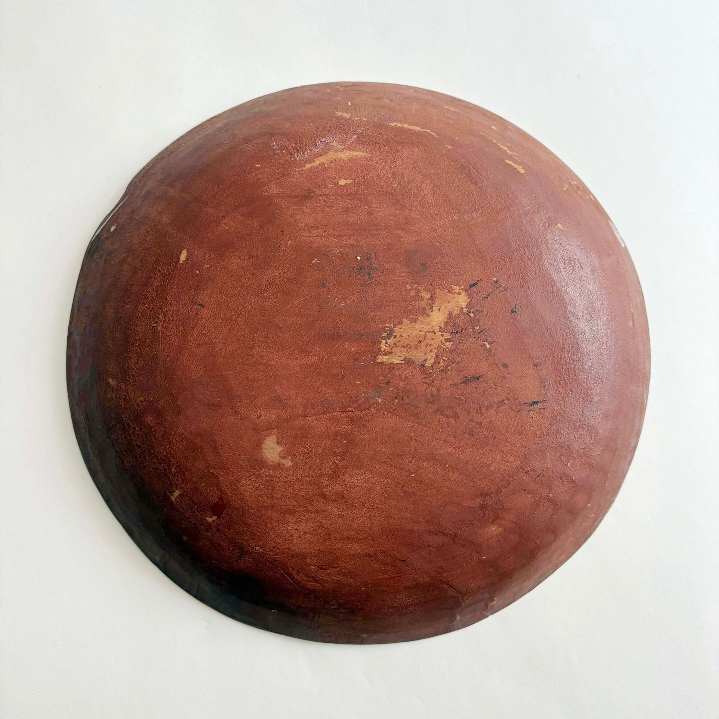 brown wooden hand carved bowl on white background