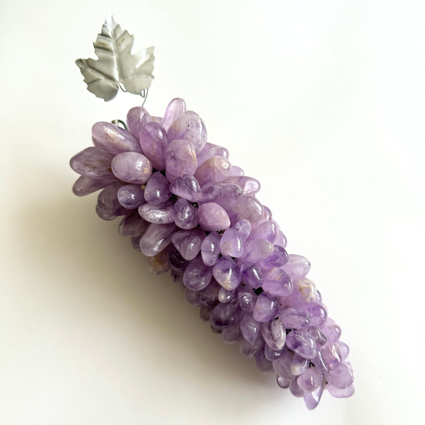 Purple decorative grapes on a white background