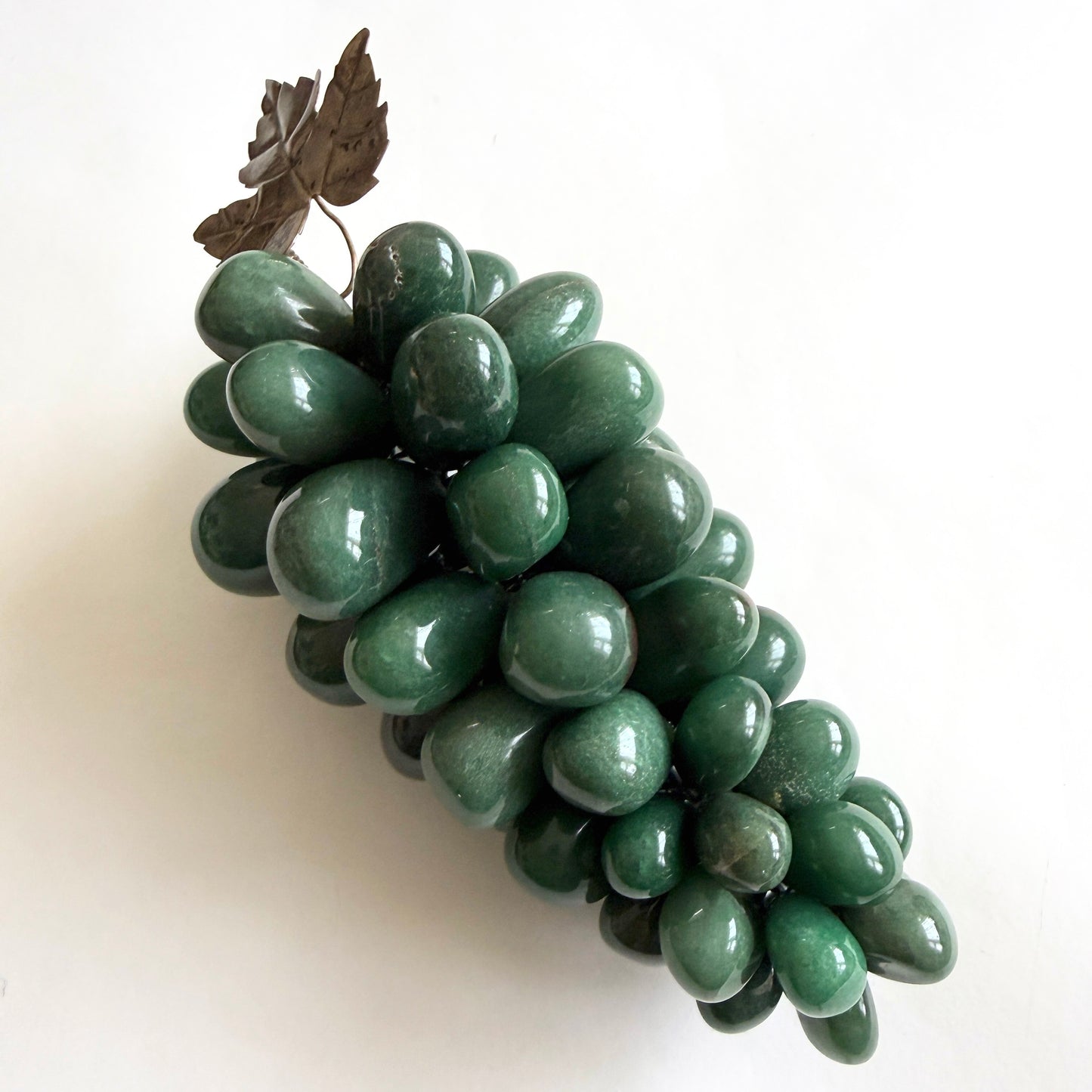 Bunch of green grapes on a white background