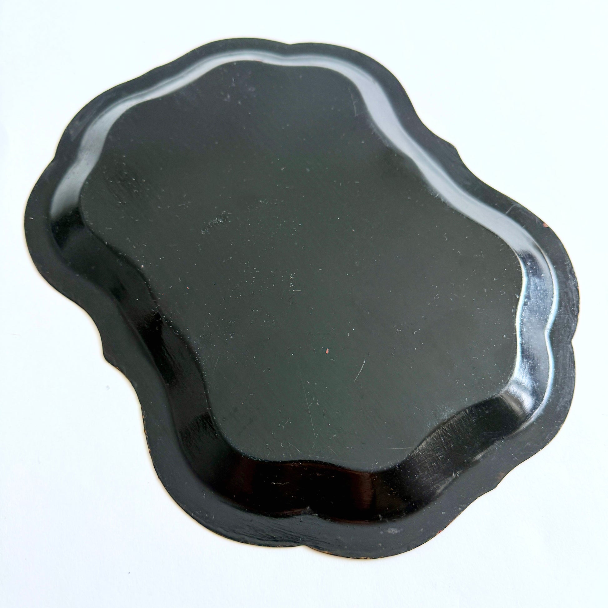 Black metal tray on a white background