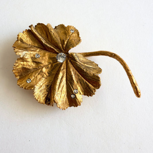 Vintage MMA Lady’s Mantle leaf brooch in gold plate with rhinestones