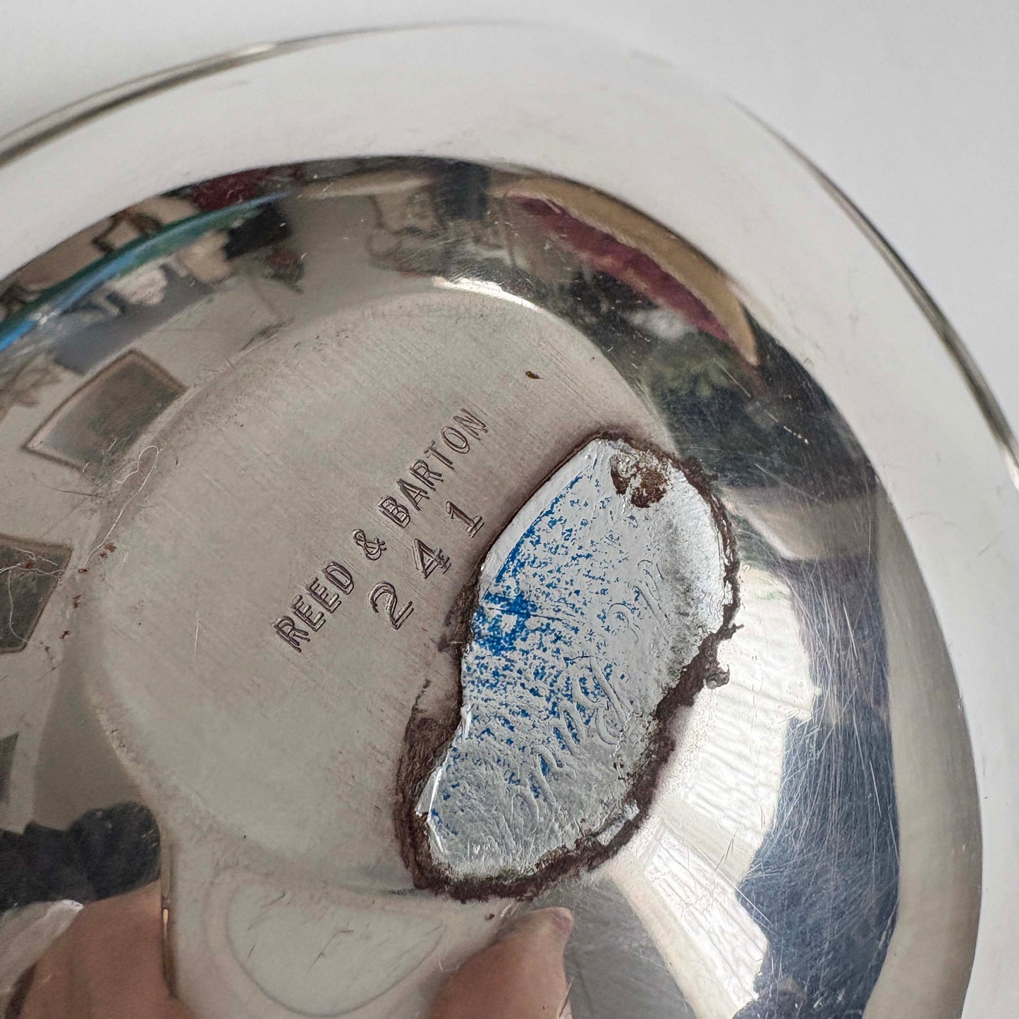Silver plate with 'Reed & Barton' engraving on a white background