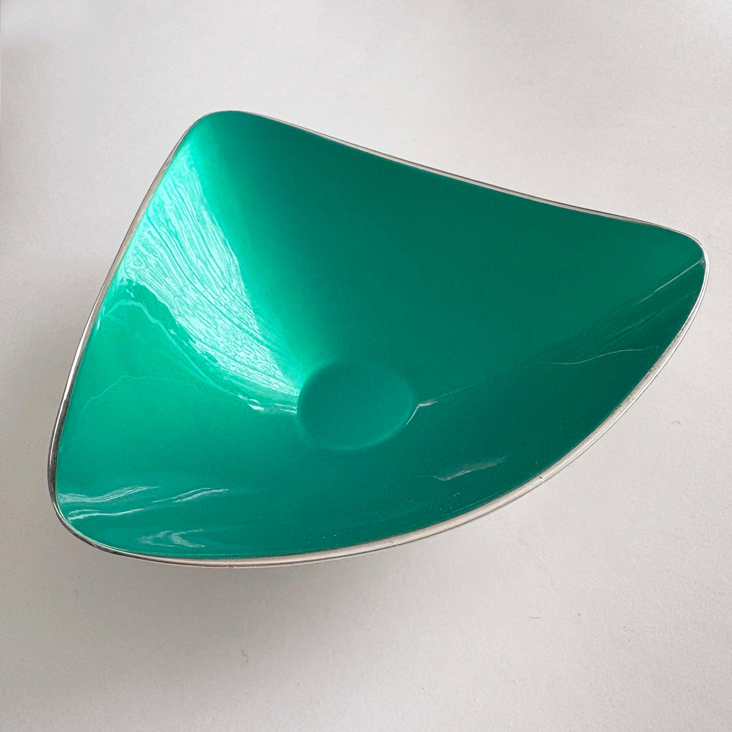 Teal silver on a white background