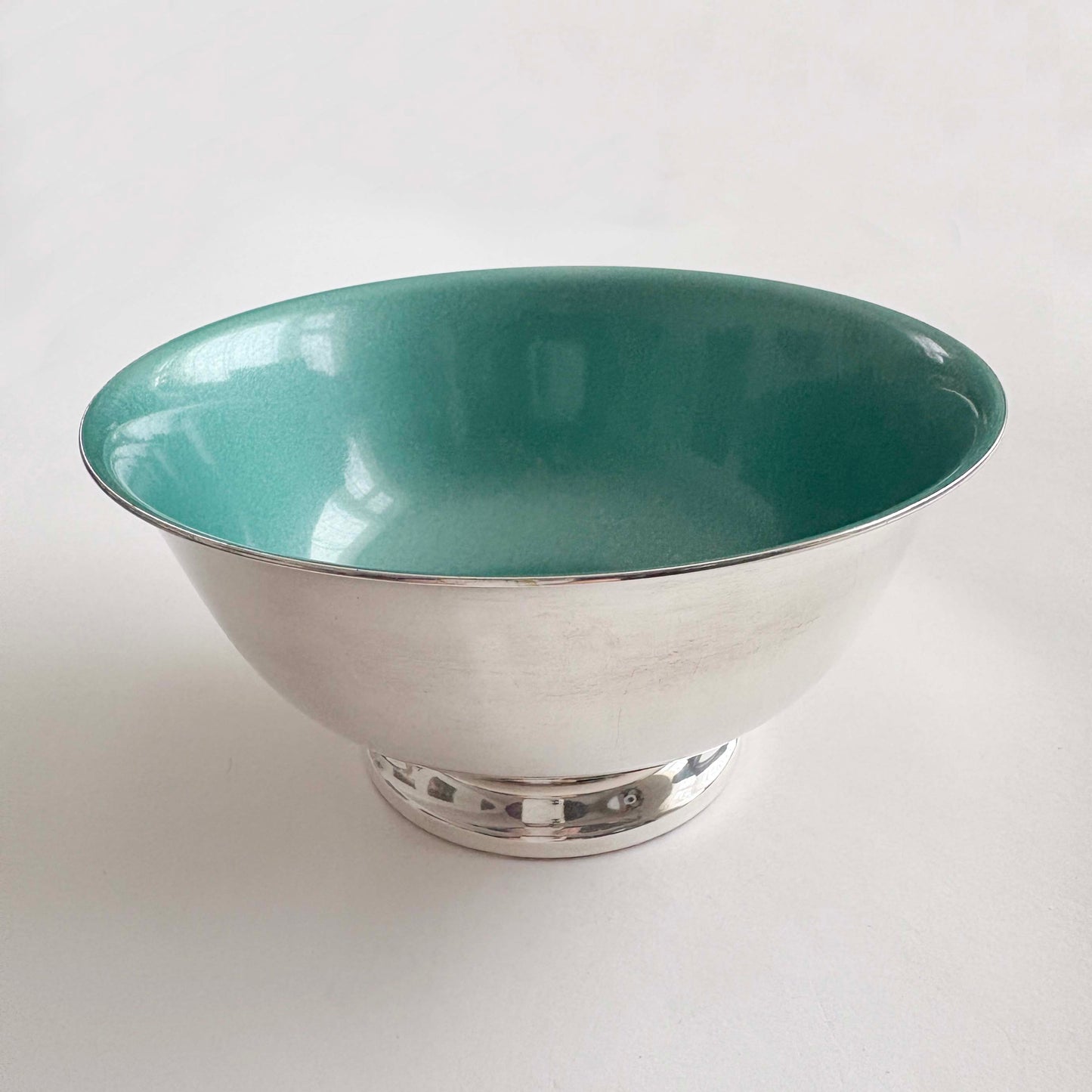 Teal silver bowl on a white background