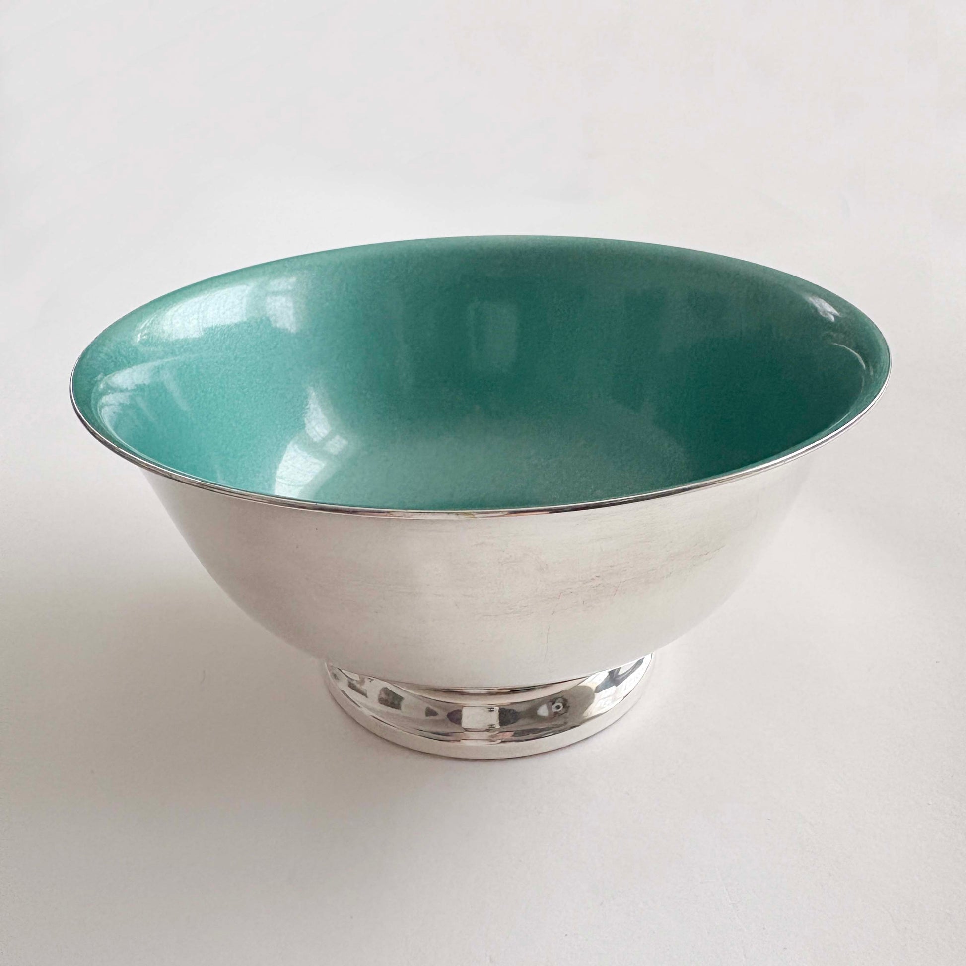 Teal silver bowl on a white background
