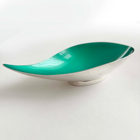 Teal and silver bowl on a white background