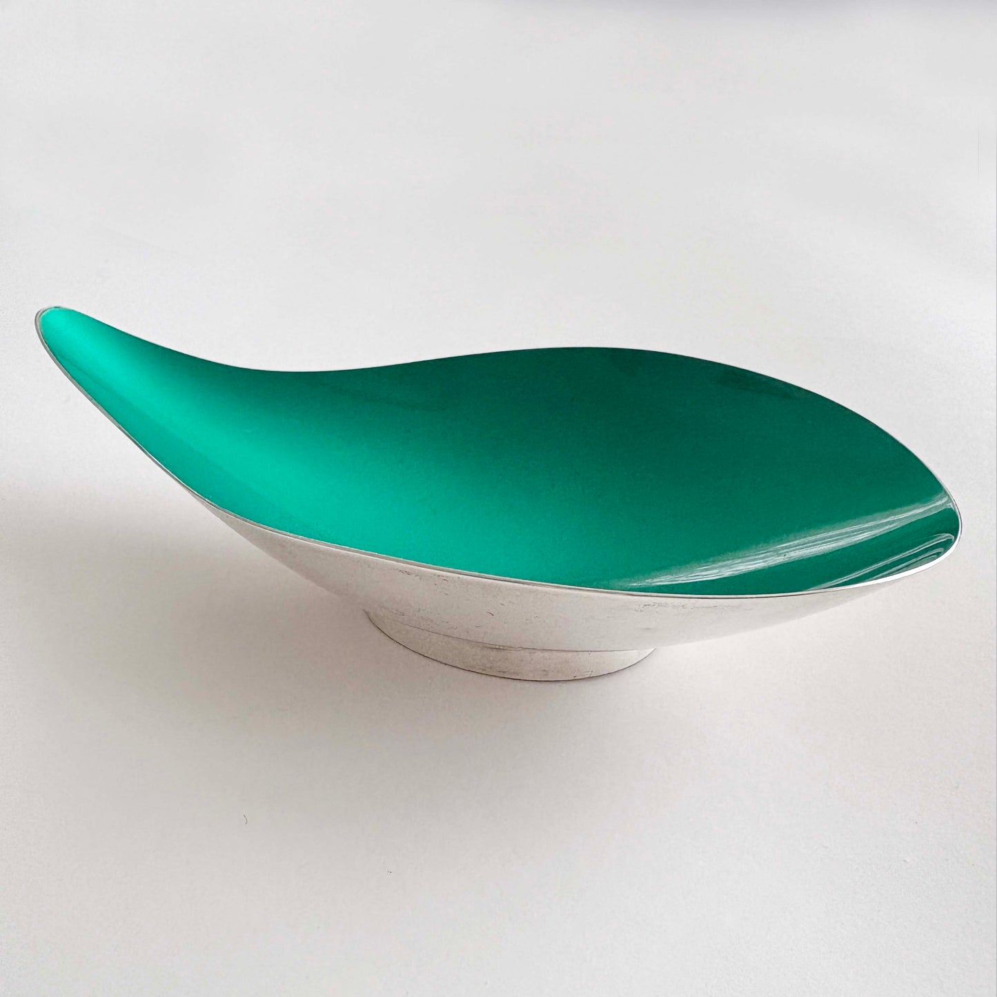 Teal silver bowl on a white background