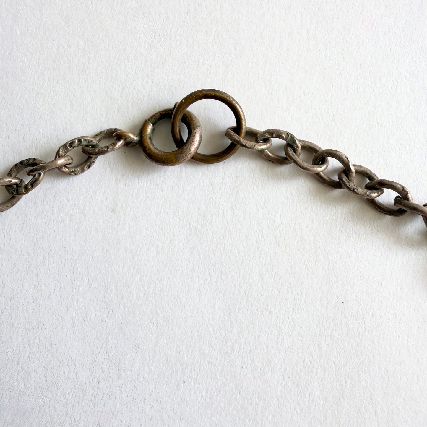 Close-up of a chain necklace on a white background
