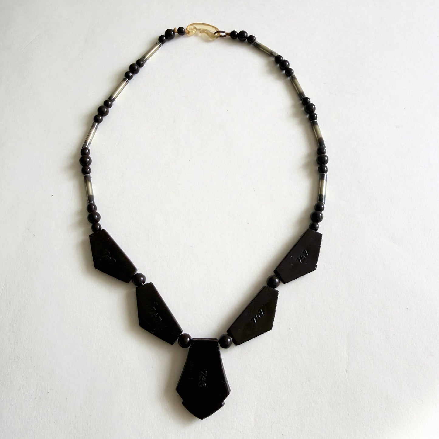 Vintage Czech Art Deco necklace with dark amethyst molded glass panels, rhinestone accents and silvered glass tube beads, circa 1930s.