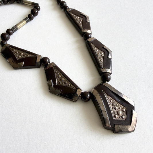 Vintage Czech Art Deco necklace with dark amethyst molded glass panels, rhinestone accents and silvered glass tube beads, circa 1930s.
