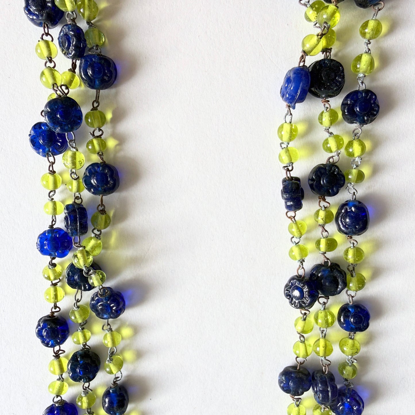 Vintage Czech glass necklace with blue floral beads and uranium green glass glowing under UV light, 53 inch strand