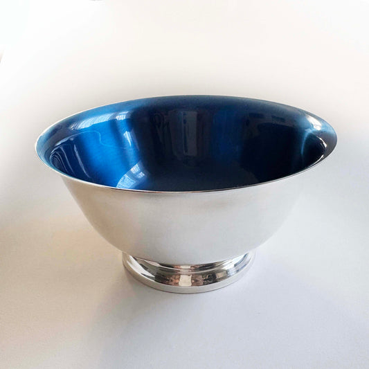 Silver bowl with blue interior on a white background