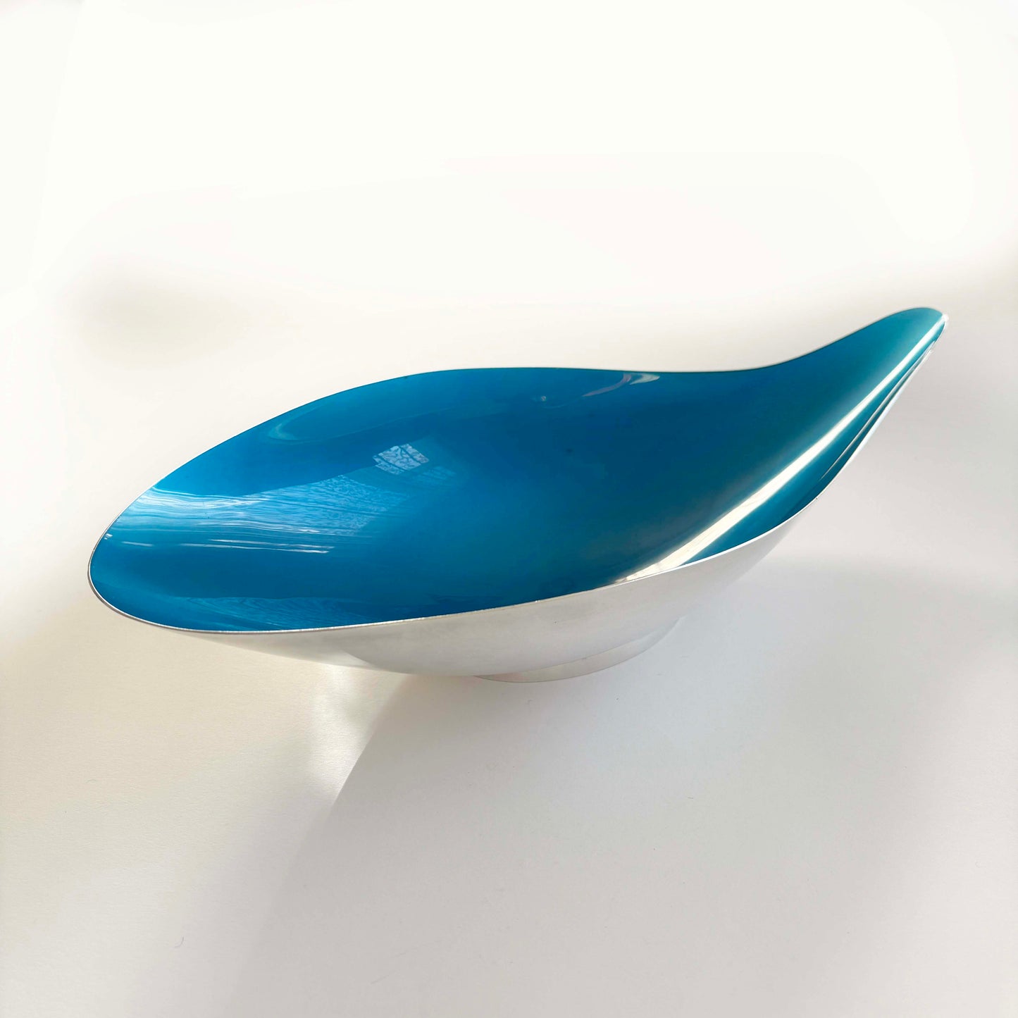 Blue and silver dish on a white background