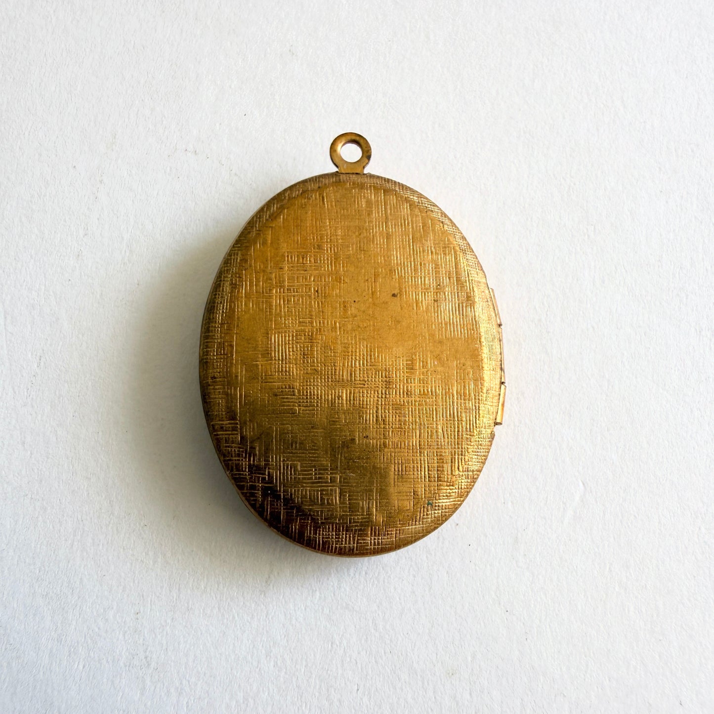 Gold locket on a white background