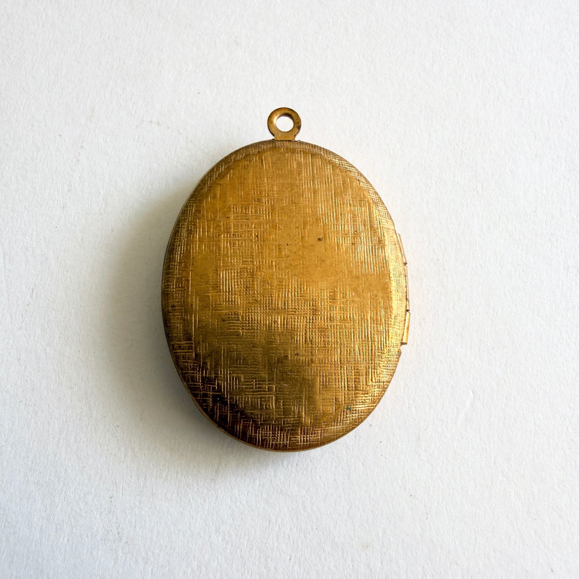 Gold locket on a white background