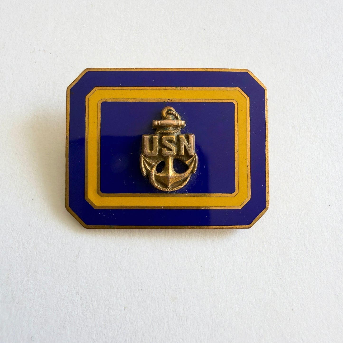 Vintage USN anchor brooch with navy blue enamel and gold tone frame, mid-century circa 1950s–60s