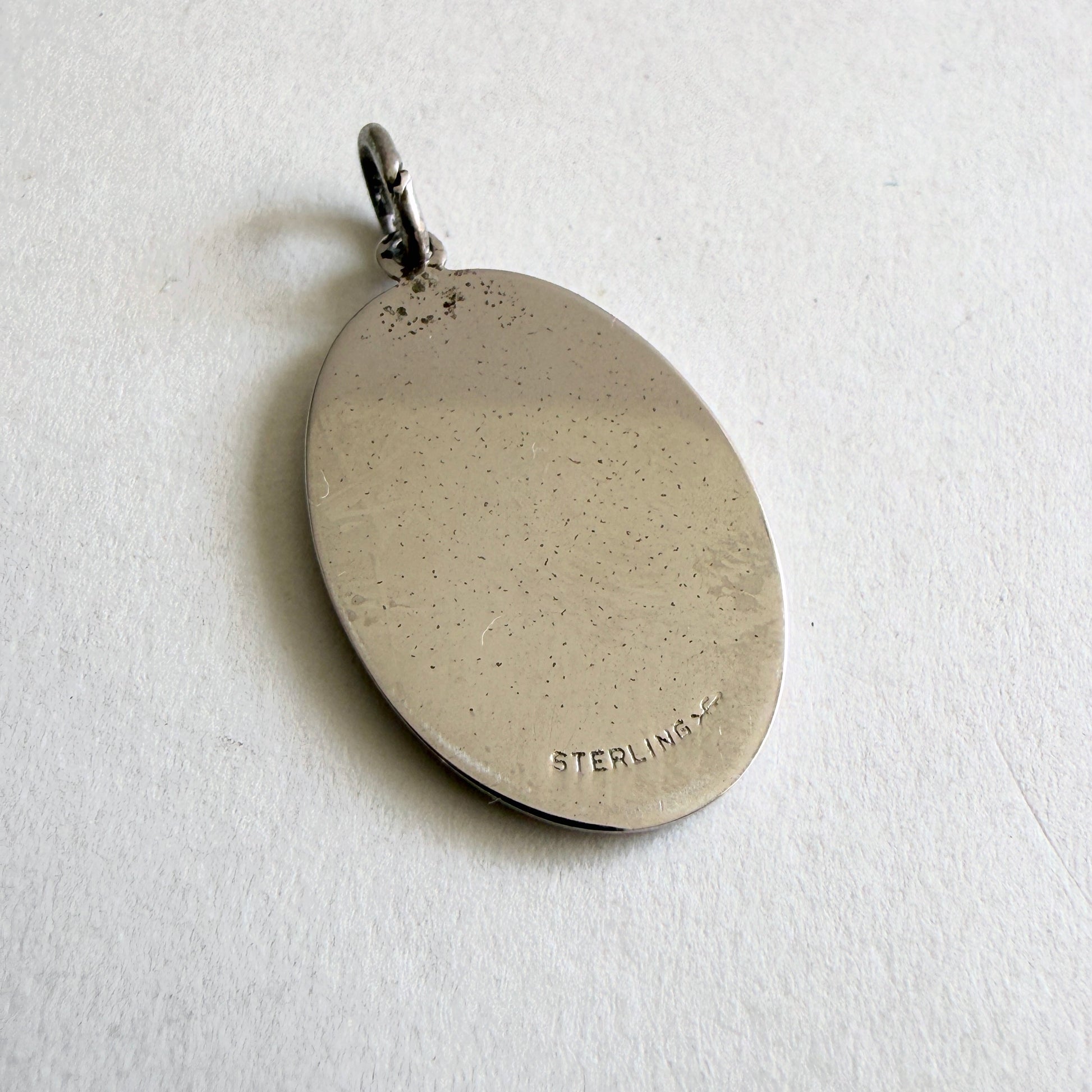 Vintage sterling silver pendant with faith hope charity symbols including cross anchor and heart