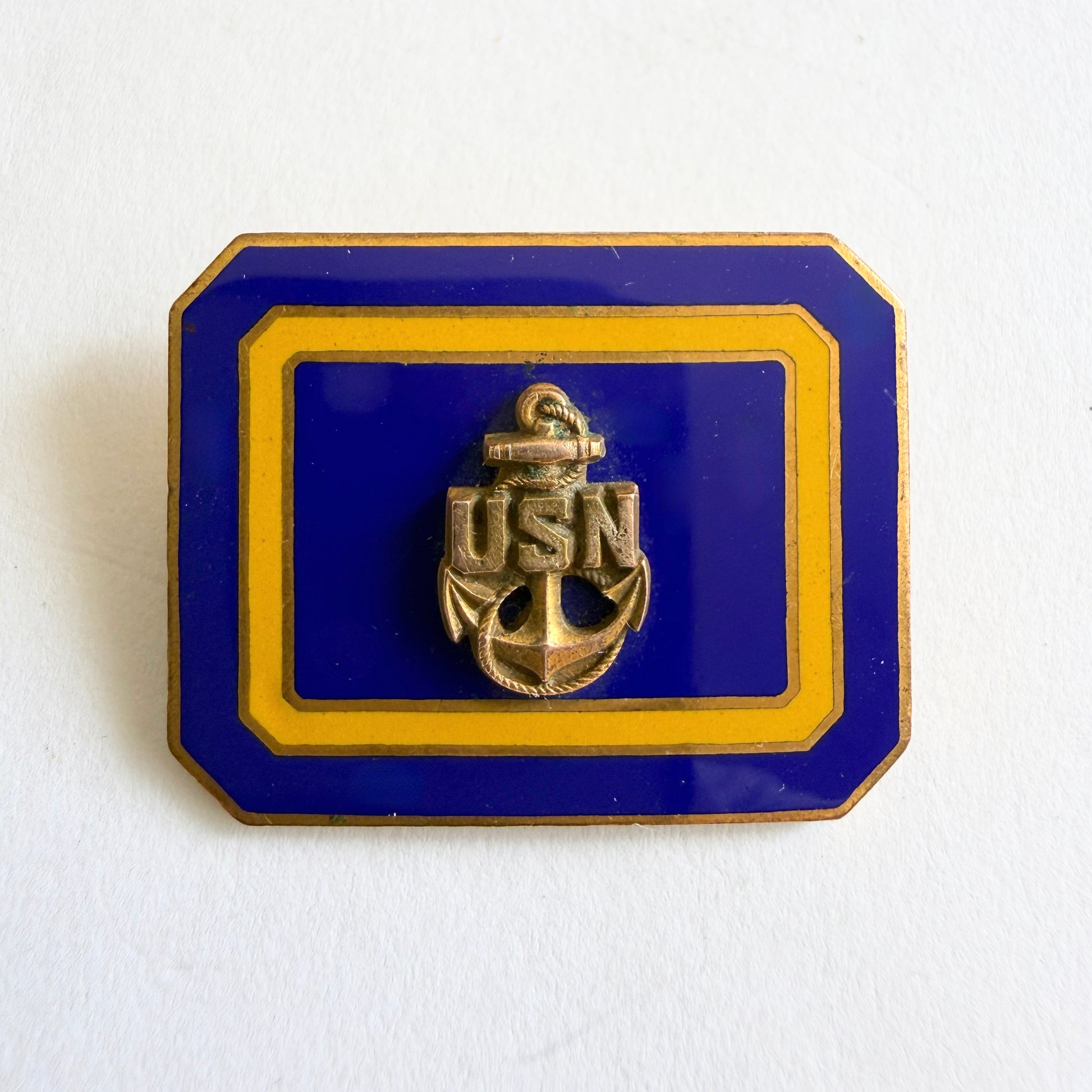 Vintage USN anchor brooch with navy blue enamel and gold tone frame, mid-century circa 1950s–60s
