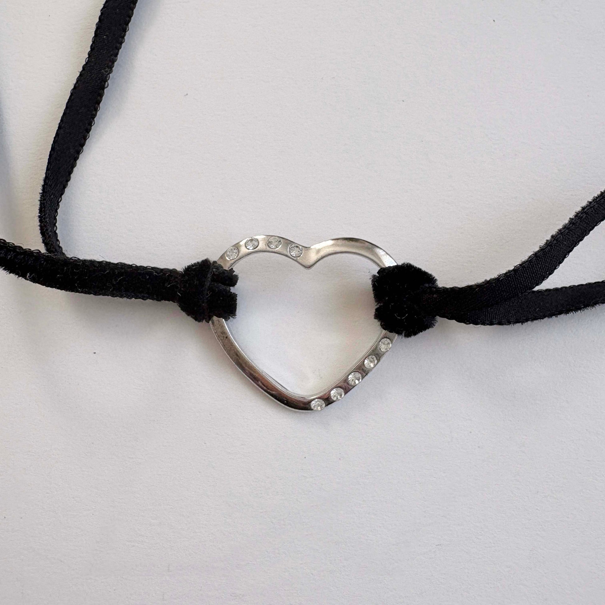 Furla sterling silver open heart choker necklace with black velvet tie cords on white background