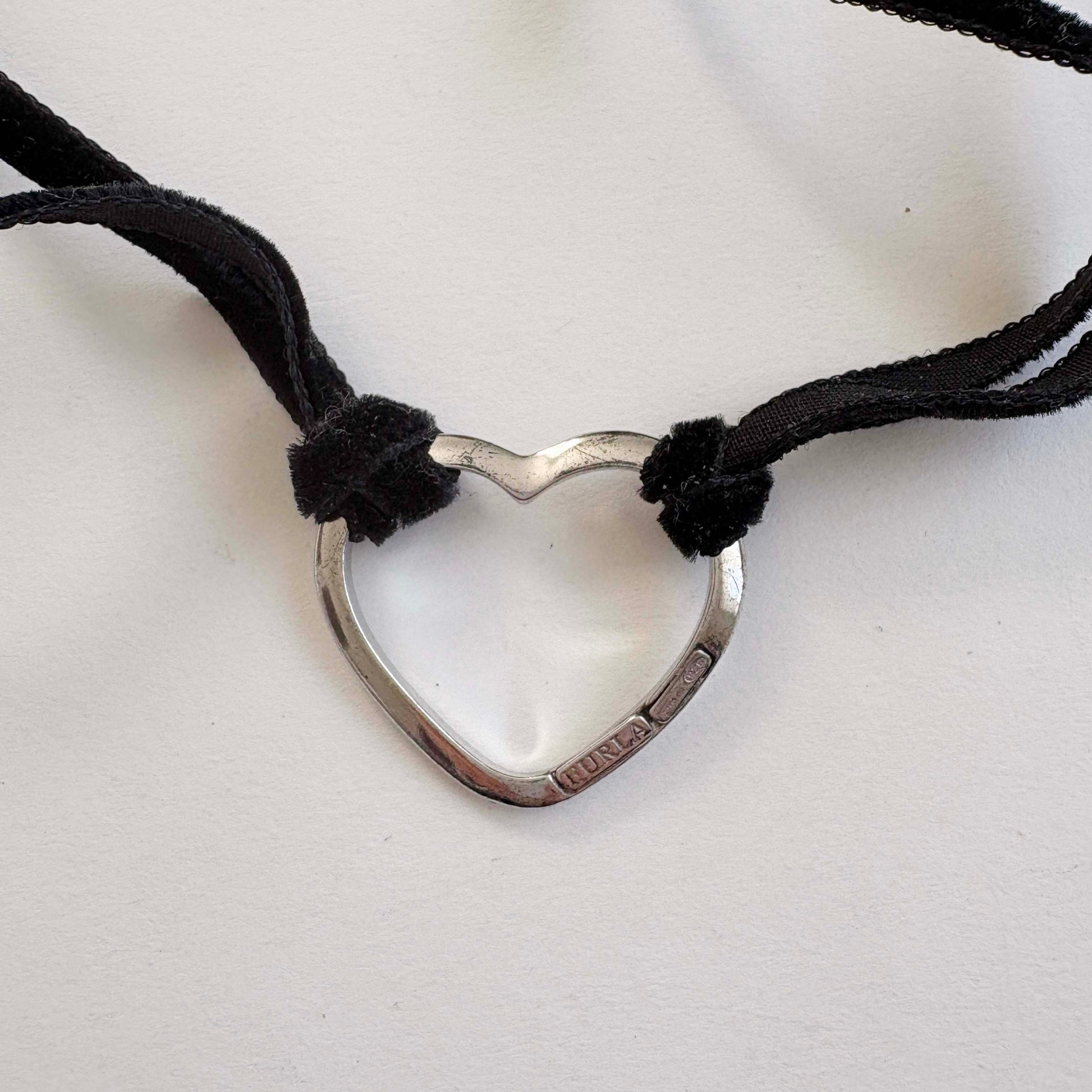 Furla sterling silver open heart choker necklace with black velvet tie cords on white background