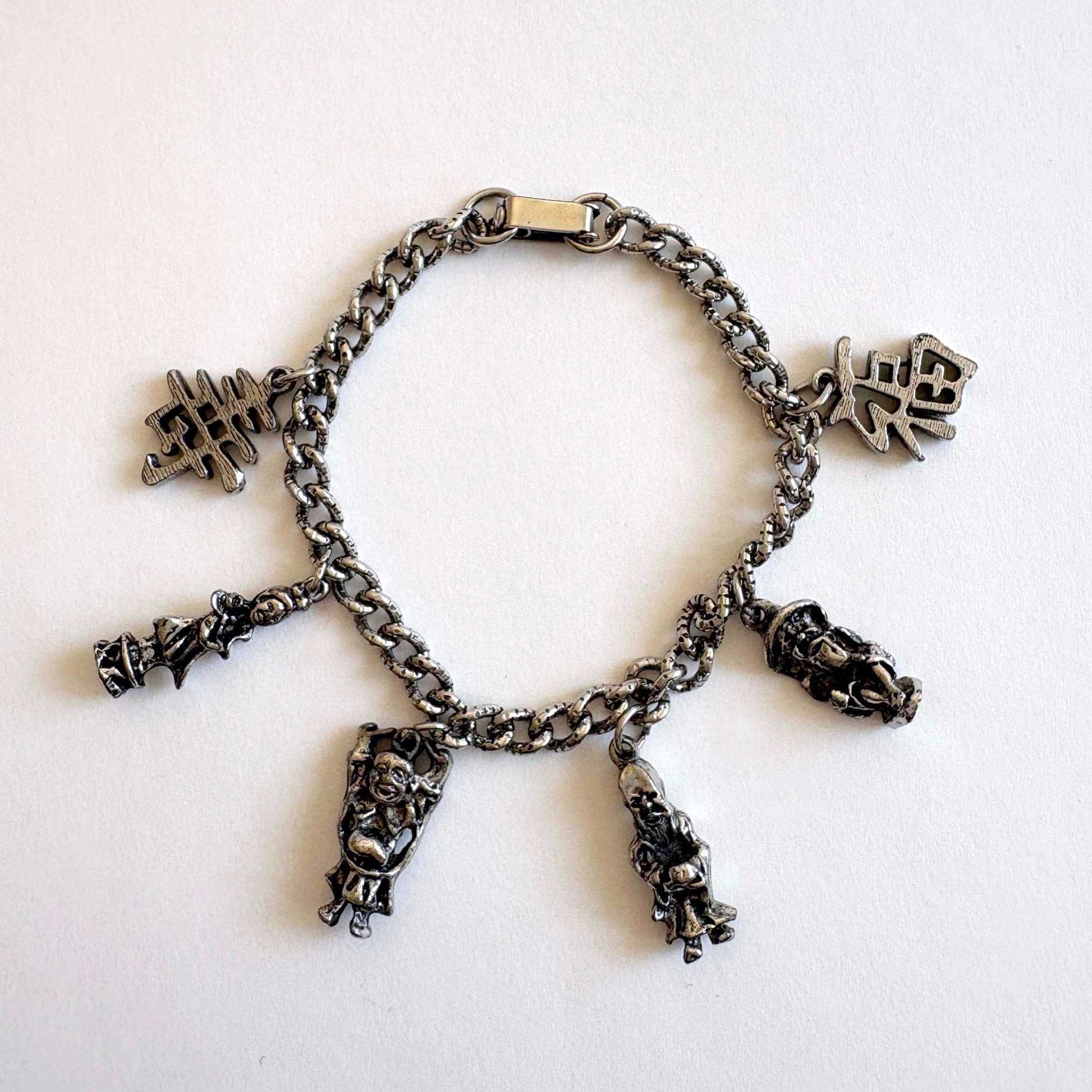 Vintage silver-tone Asian tourist charm bracelet with figural charms attributed to Coro
