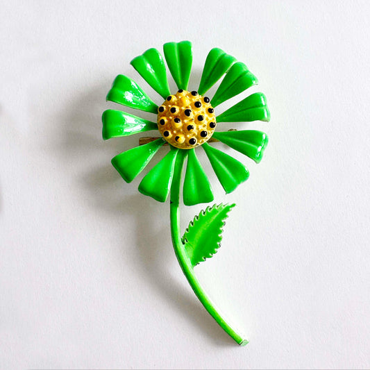 Vintage green enamel flower brooch with yellow center, 1960s–1970s Flower Power pin