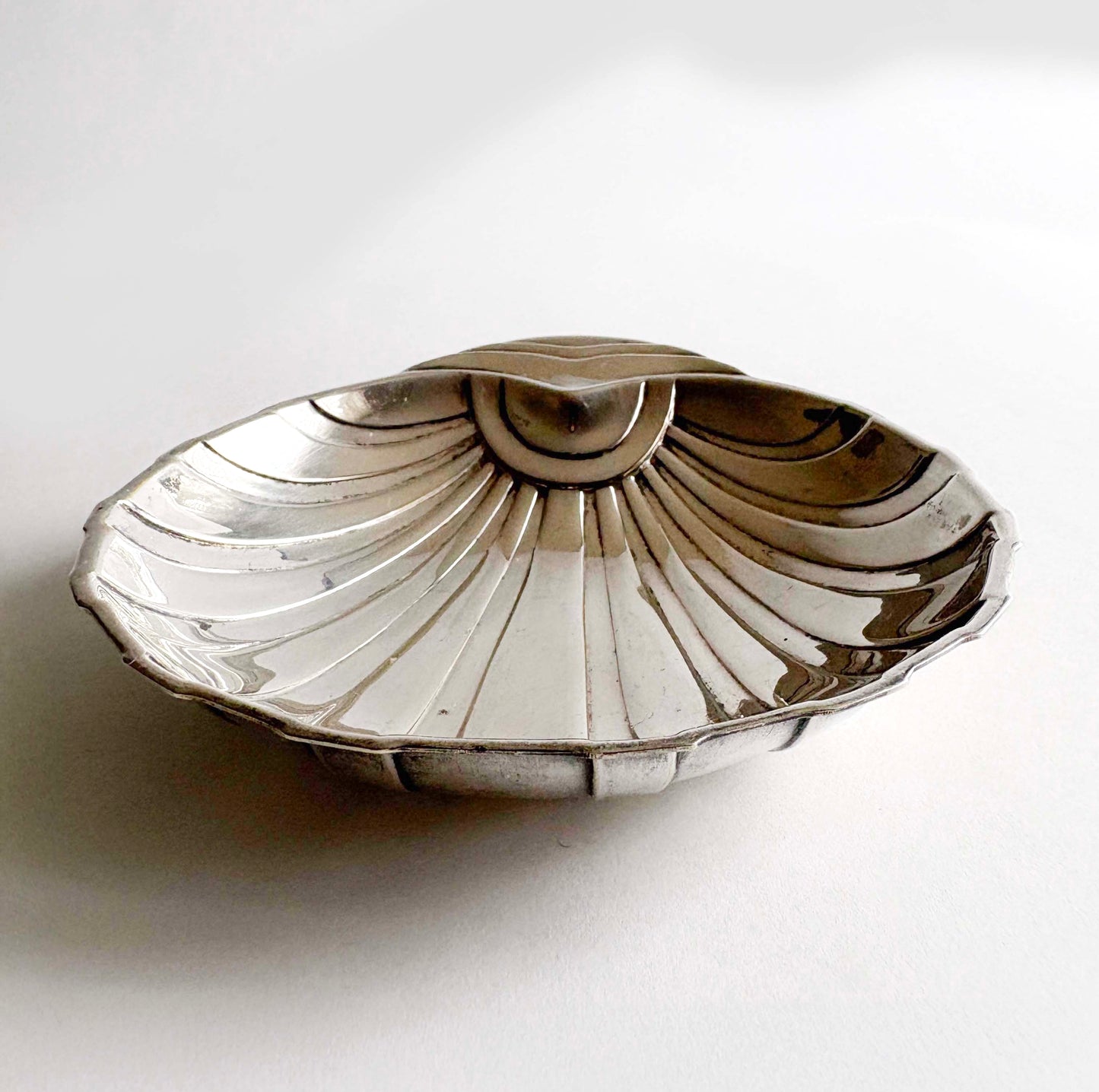 Art Deco shell-shaped silver plate dish by F.B. Rogers on white background