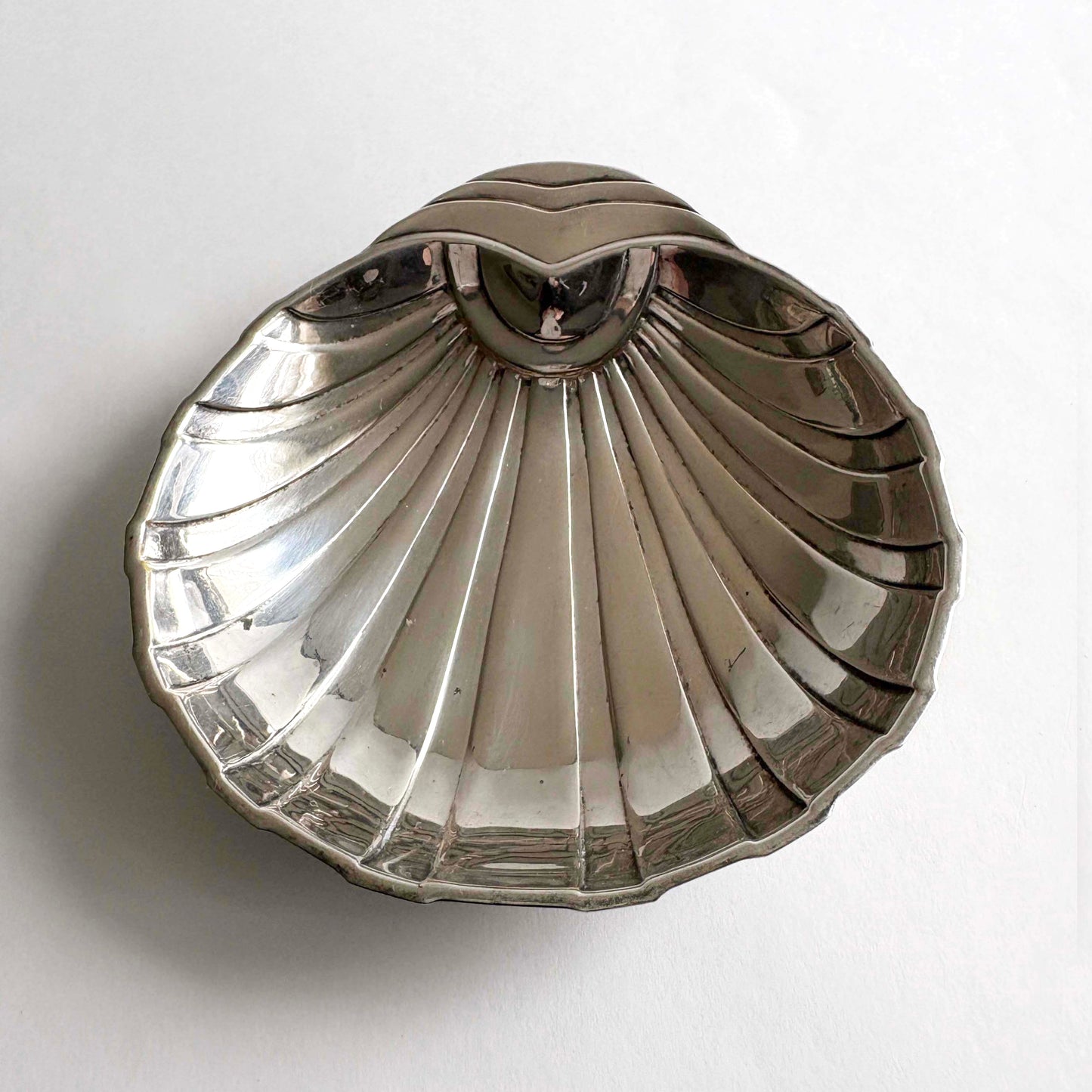 Art Deco shell-shaped silver plate dish by F.B. Rogers on white background