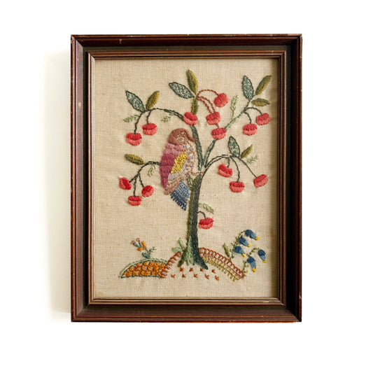 Vintage American folk art embroidery of bird in cherry tree in wood frame