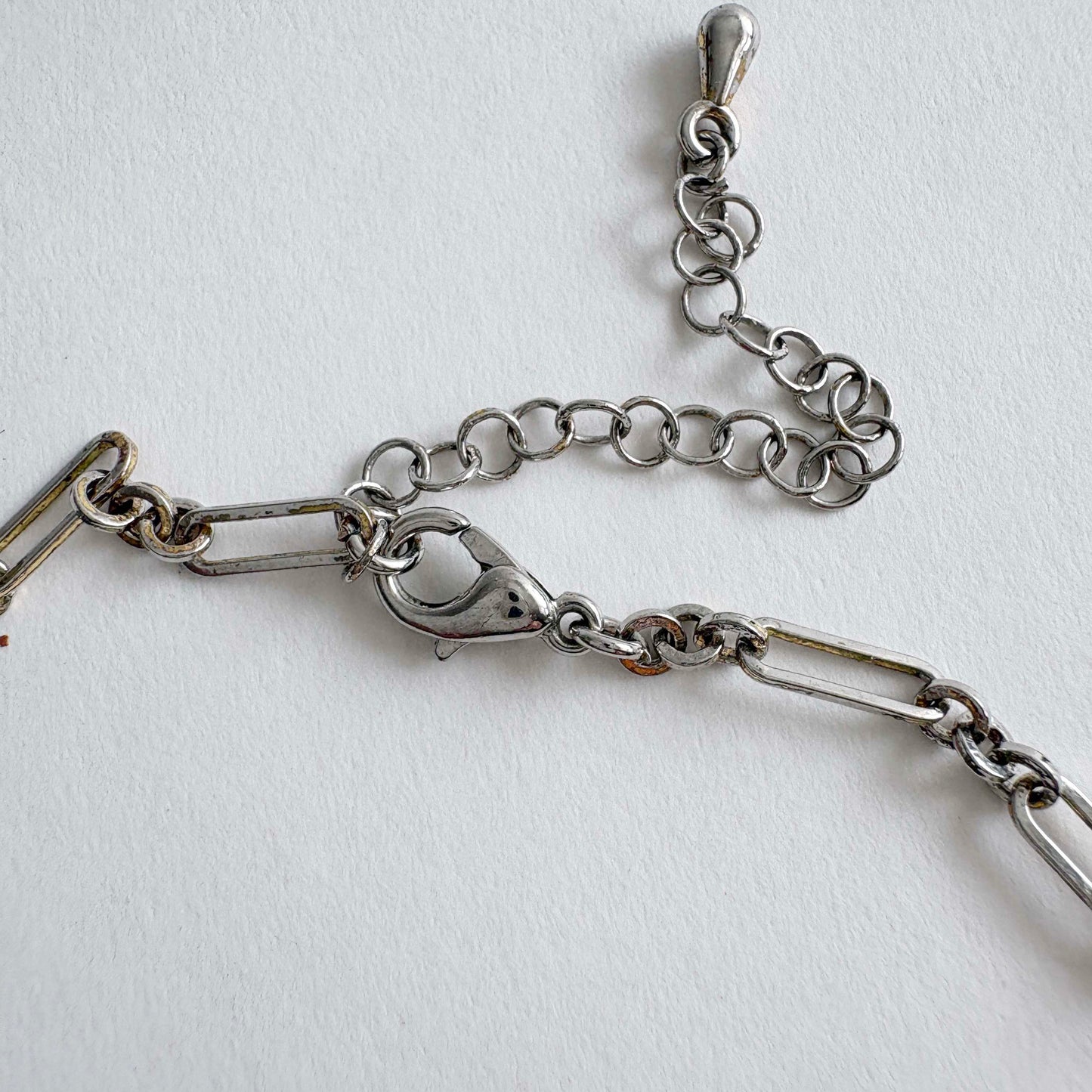 Silver chain necklace on a white background