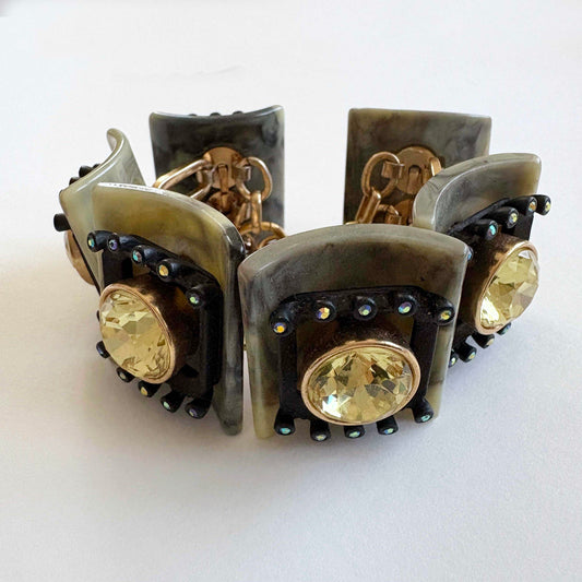 jcrew brûlée Bracelet with gold stones and black and green accents on a white background