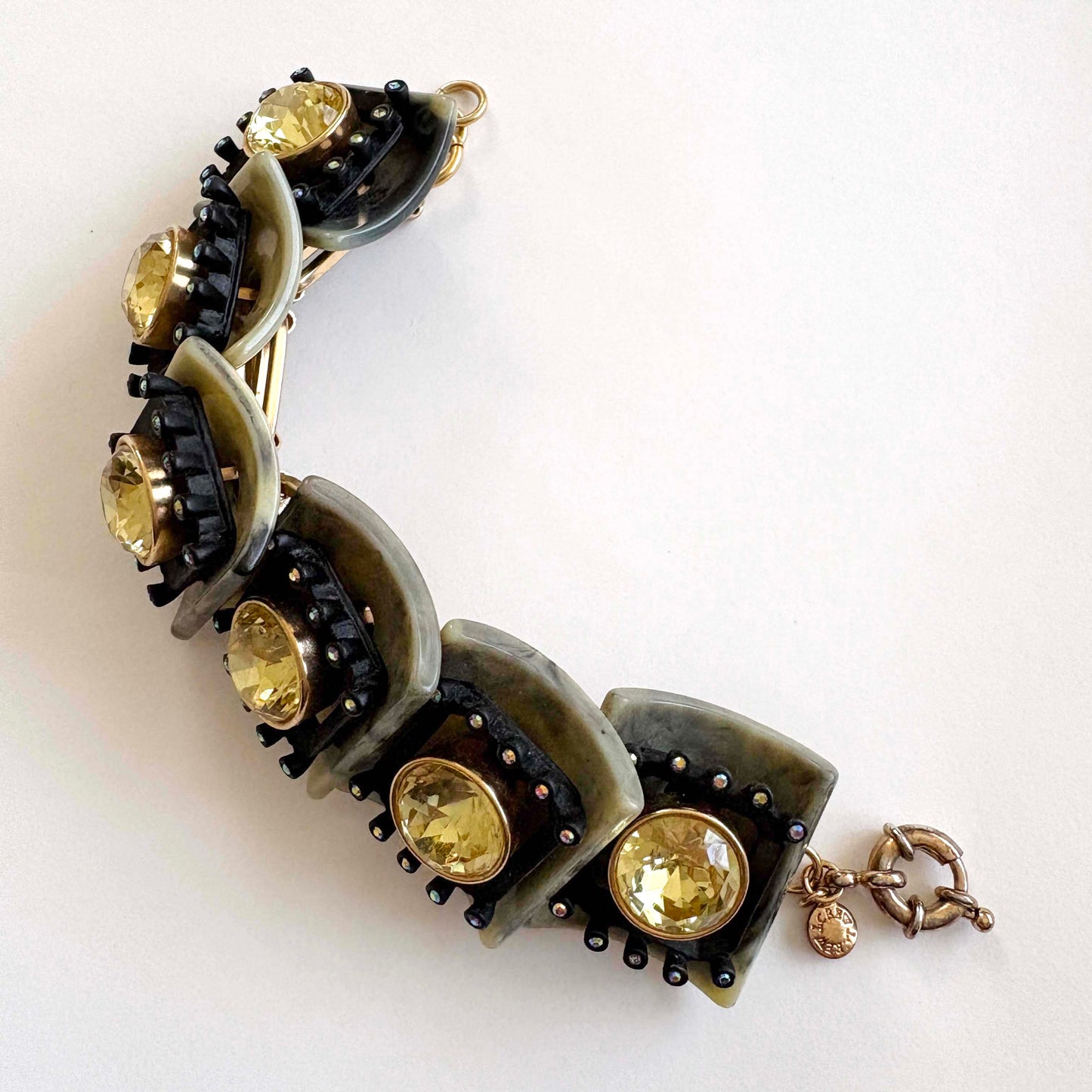 jcrew brûlée Bracelet with gold stones and black and green accents on a white background
