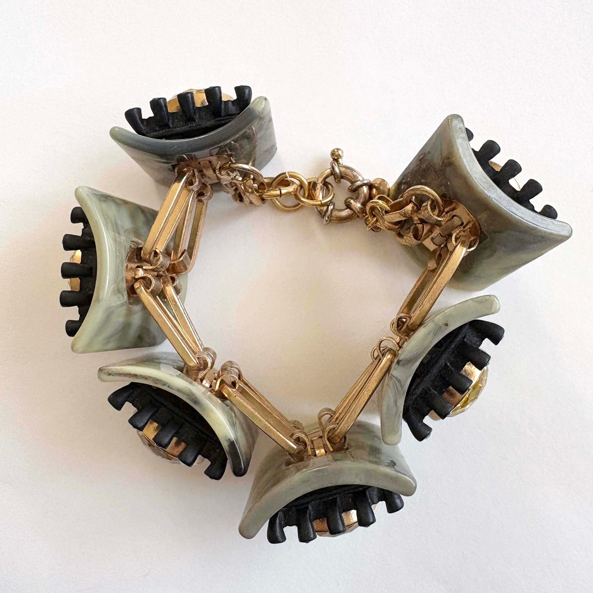 jcrew brûlée Bracelet with gold stones and black and green accents on a white background