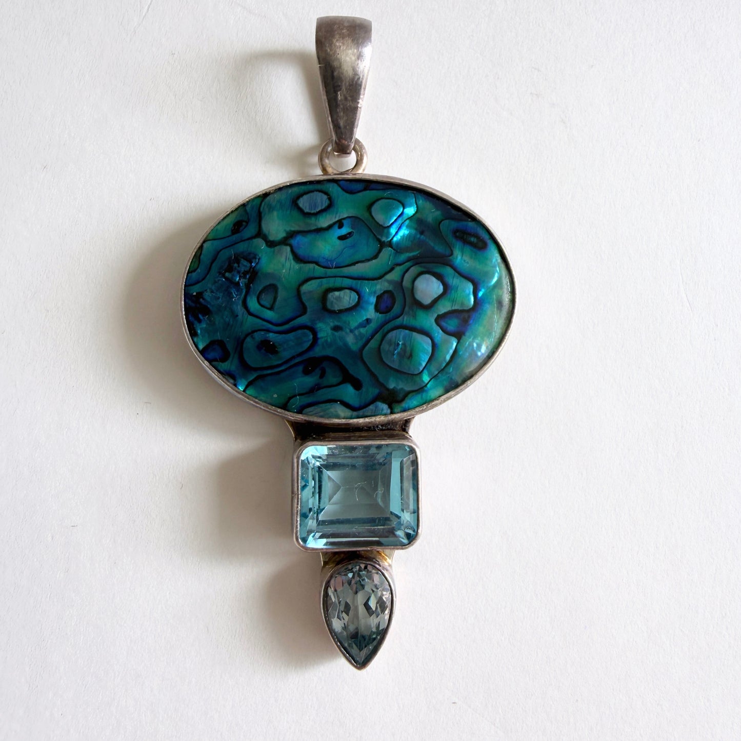 Full view of the 'Reef Mirror' Charles Albert pendant in high-purity .950 fine sterling silver with a blue abalone shell focal.