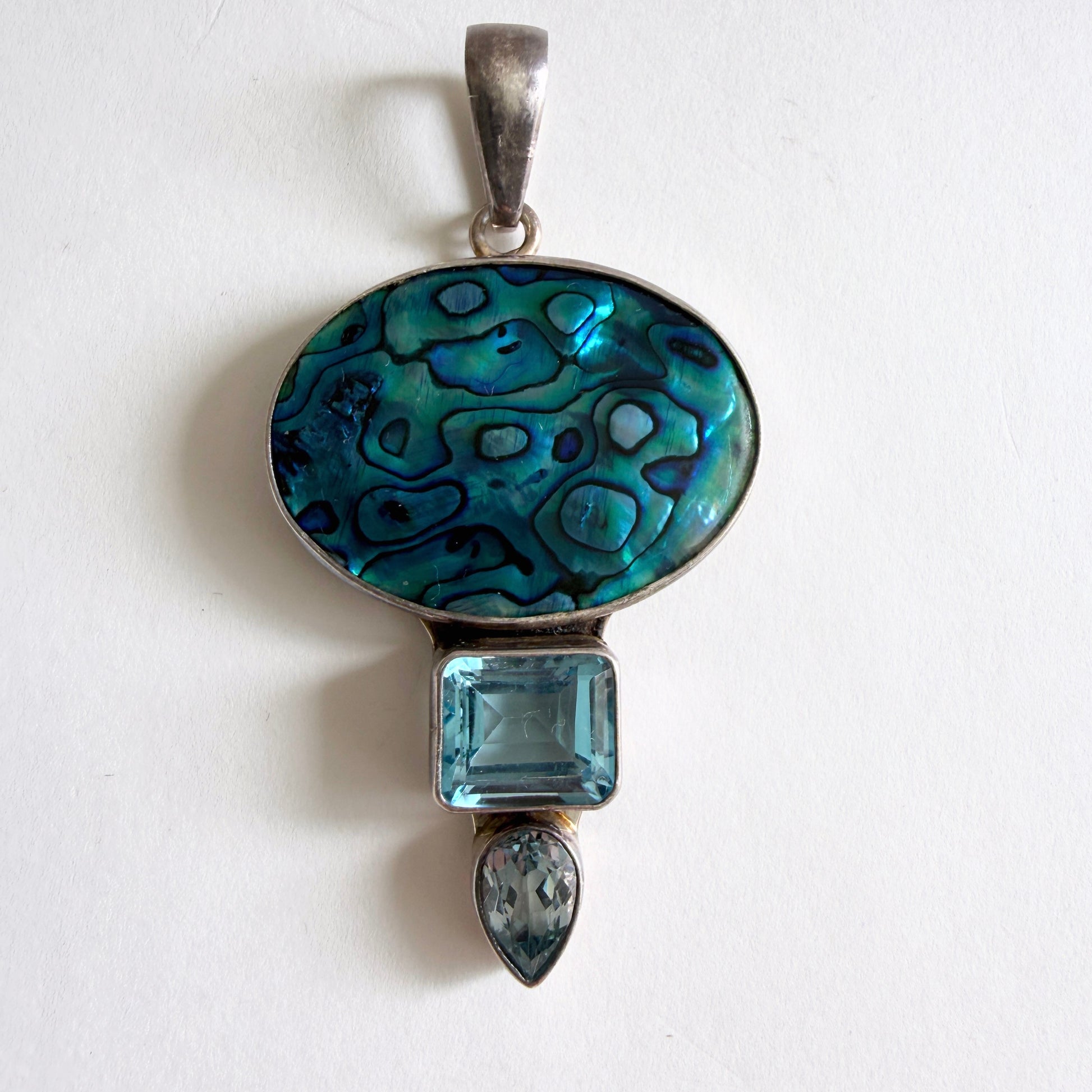 Full view of the 'Reef Mirror' Charles Albert pendant in high-purity .950 fine sterling silver with a blue abalone shell focal.