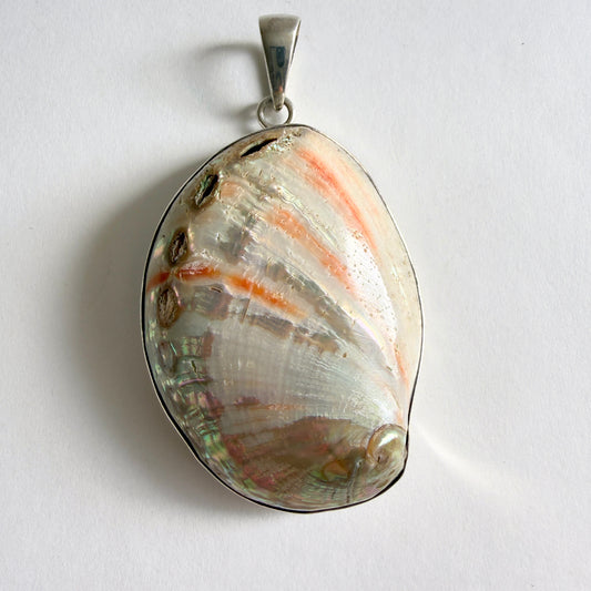 Full view of the 'Coastal Fragment' Charles Albert pendant, featuring a large, natural abalone shell in a .950 fine sterling silver bezel.