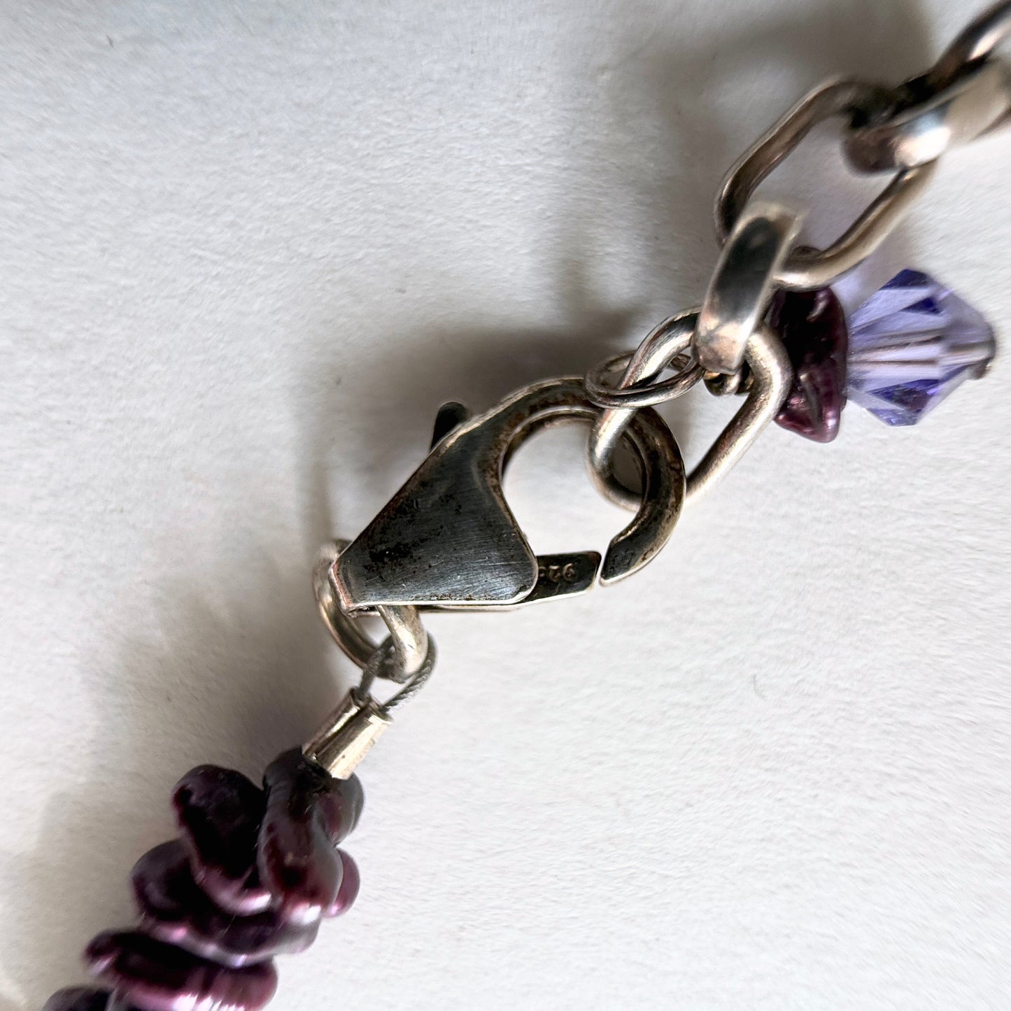 Detailed view of the .925 sterling silver lobster clasp and extender chain.