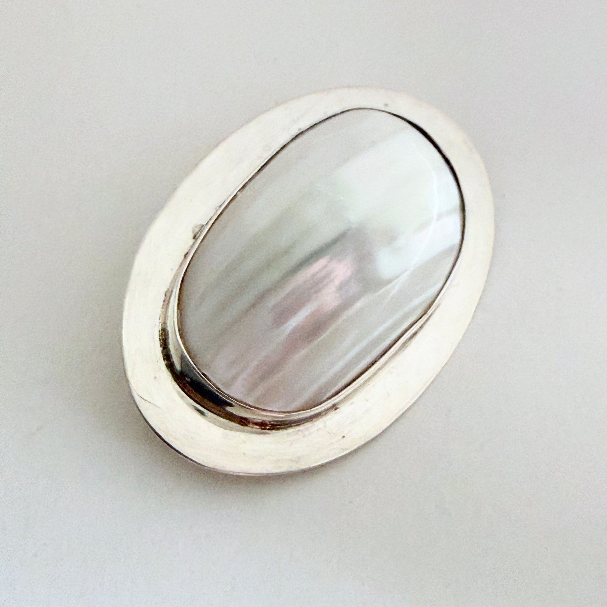 Side profile highlighting the 'high-dome' architectural setting and the substantial thickness of the Great Falls studio silver.