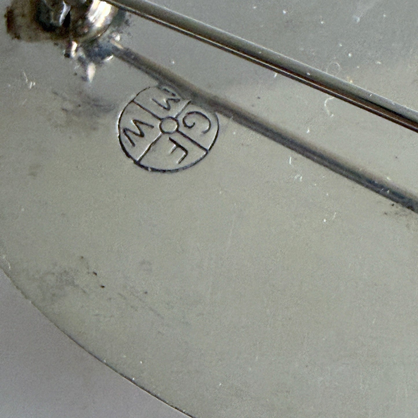 The reverse of the brooch showing the authentic 'GFMW' hallmark.