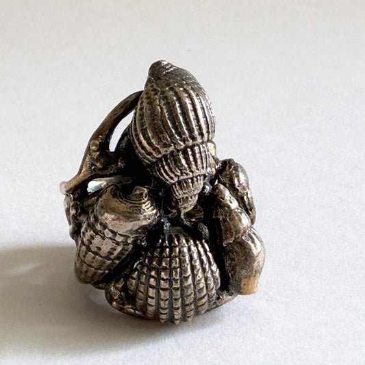 Top view of the 'Grotto' sterling silver statement ring featuring a dimensional cluster of various seashell forms.