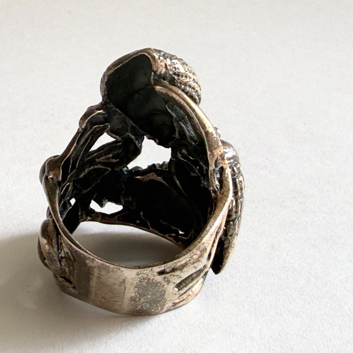 Side profile of the ring showing the layered, sculptural composition that wraps comfortably around the finger.