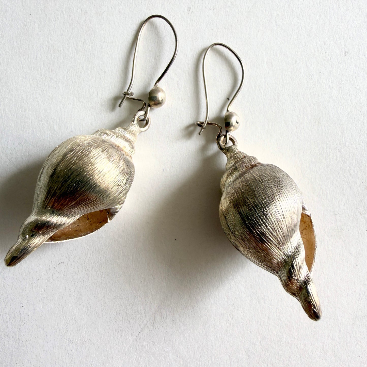 Side profile of the Neptune earrings, demonstrating the bold 3D sculptural form and delicate hand-tested sterling silver purity.