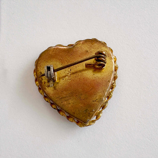 gold Heart-shaped brooch on a white background